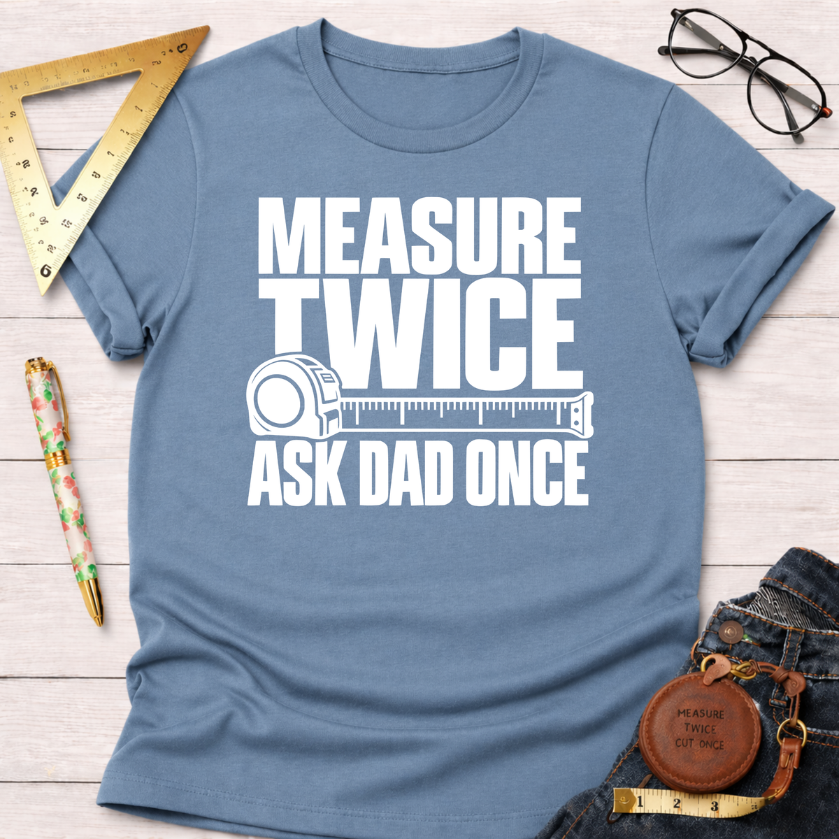Measure Twice Ask Dad Once funny woodworking t-shirt, distressed white lettering on steel blue – Sawdust & Ponytails (view 1)