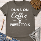 Women's funny woodworking graphic tee shirt for female woodworkers, makers, and DIY builders — Sawdust & Ponytails. Dark gray cotton tee with "Runs On Coffee & Power Tools" in white text.