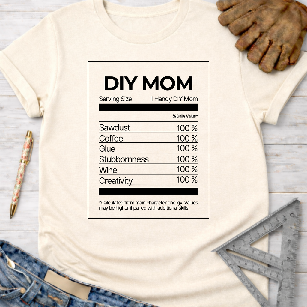 Women's funny woodworking graphic tee shirt for female woodworkers, makers, and DIY builders — Sawdust & Ponytails. Cream t-shirt with "DIY MOM Nutrition Facts" graphic.