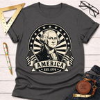 Charcoal gray George Washington America EST 1776 T-shirt with a patriotic black and white graphic.
