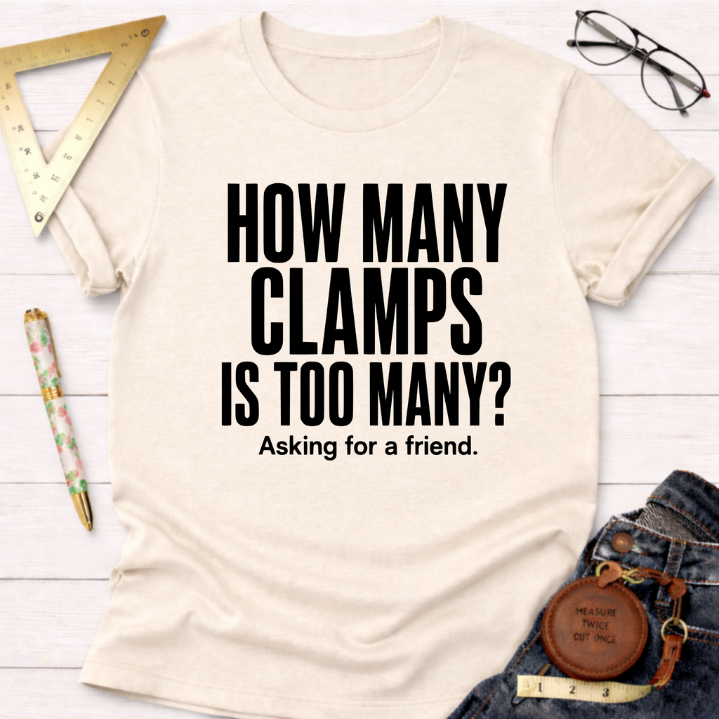 Cream t-shirt with "HOW MANY CLAMPS IS TOO MANY? Asking for a friend." in black text.