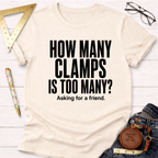Cream t-shirt with "HOW MANY CLAMPS IS TOO MANY? Asking for a friend." in black text.