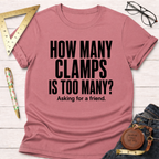 Heather dust pink t-shirt with "HOW MANY CLAMPS IS TOO MANY? Asking for a friend." in black text.