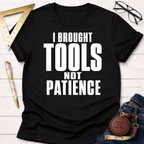 Women's funny woodworking graphic tee shirt for female woodworkers, makers, and DIY builders — Sawdust & Ponytails. Black cotton tee with "I BROUGHT TOOLS NOT PATIENCE" in white text.