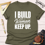 Olive green cotton t-shirt with "I Build Like A Woman. Keep Up." in white text, styled with tools.