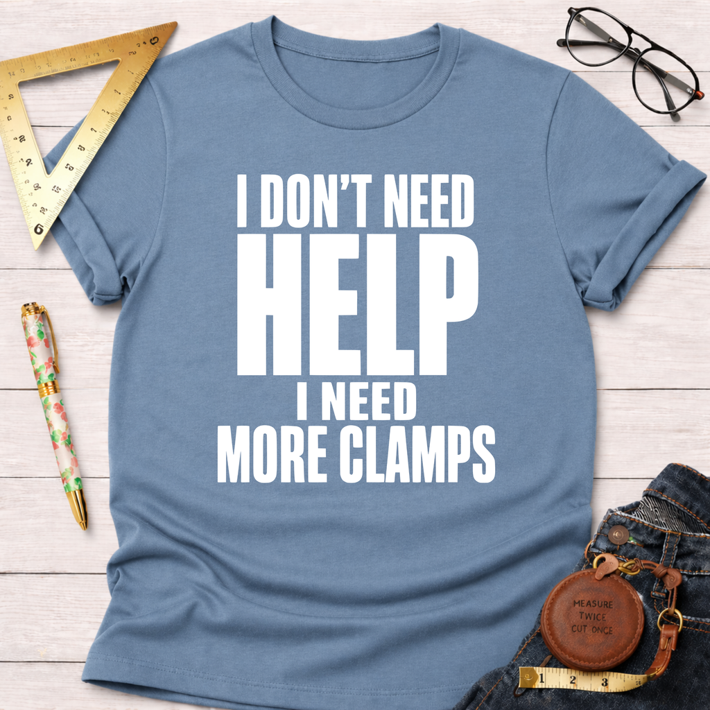 Light blue unisex cotton t-shirt with "I Don't Need HELP I Need MORE CLAMPS" in white text.