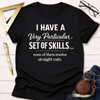 Black cotton t-shirt with "I Have A Very Particular Set Of Skills... none of them involve straight cuts." text.