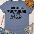 Women's funny woodworking graphic tee shirt for female woodworkers, makers, and DIY builders — Sawdust & Ponytails. Blue cotton tee with "I Like Coffee, Woodworking, And Maybe 3 People" in black text.