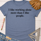 Women's funny woodworking graphic tee shirt for female woodworkers, makers, and DIY builders — Sawdust & Ponytails. Blue cotton tee with "I like working alone more than I like people" text.