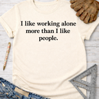 Women's funny woodworking graphic tee shirt for female woodworkers, makers, and DIY builders — Sawdust & Ponytails. Cream t-shirt with "I like working alone more than I like people." text.