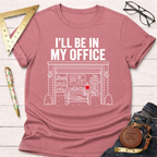 Pink cotton t-shirt with "I'll Be In My Office" text and a white line drawing of a garage workshop.