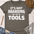 Women's funny woodworking graphic tee shirt for female woodworkers, makers, and DIY builders — Sawdust & Ponytails. Dark gray short-sleeve tee with "It's Not Hoarding If It's Tools" in white text.