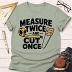 Sage green "Measure Twice And Cut Once" graphic t-shirt with a tape measure and saw design.