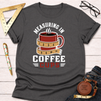 Charcoal gray t-shirt with "Measuring In Coffee Cups" design featuring a red coffee mug wrapped in a measuring tape.