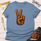 Blue cotton t-shirt with a wood-textured peace sign graphic, styled with jeans, glasses, and a ruler.