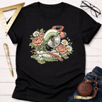 Black cotton t-shirt with a colorful floral miter saw graphic, surrounded by pink peonies and white daisies.