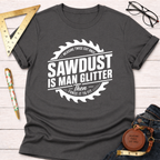 Charcoal gray cotton t-shirt with "Sawdust Is Man Glitter" graphic, surrounded by a saw blade design.
