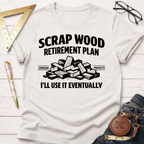 Off-white t-shirt with "Scrap Wood Retirement Plan" text, wood pile graphic, and "I'll Use It Eventually.