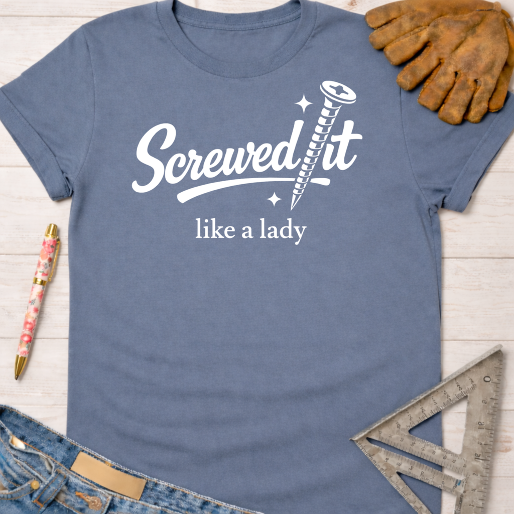 Women's funny woodworking graphic tee shirt for female woodworkers, makers, and DIY builders — Sawdust & Ponytails. Blue cotton tee with "Screwed it like a lady" graphic.