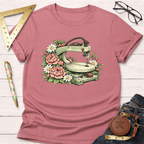 Pink t-shirt with a scroll saw surrounded by pink roses and white daisies.