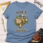 Blue cotton t-shirt with "Soft Doesn't Mean Weak" text, a hammer, and pink floral design.