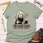 Sage green "The Numbers T-Shirt" with a cartoon Einstein holding wood and a ruler, text reads "The Numbers Checked Out The Board Didn't".