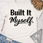 Women's funny woodworking graphic tee shirt for female woodworkers, makers, and DIY builders — Sawdust & Ponytails. Cream t-shirt with "Built It Myself" in black script.