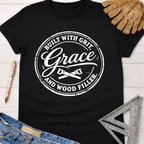Black cotton tee with "Built With Grit, Grace, and Wood Filler" graphic. Women's funny woodworking graphic tee shirt for female woodworkers, makers, and DIY builders — Sawdust & Ponytails.