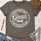 Women's funny woodworking graphic tee shirt for female woodworkers, makers, and DIY builders — Sawdust & Ponytails. Dark gray cotton tee with "Built With Grit, Grace, and Wood Filler" graphic.
