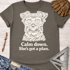 Women's funny woodworking graphic tee shirt for female woodworkers, makers, and DIY builders — Sawdust & Ponytails. Charcoal cotton tee with a white graphic of a dog wearing safety goggles and the text "Calm down. She's got a plan.