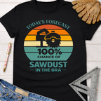 Women's funny woodworking graphic tee shirt for female woodworkers, makers, and DIY builders — Sawdust & Ponytails. Black cotton t-shirt with a retro sunset graphic and "Today's Forecast 100% Chance of Sawdust in the Bra" text.
