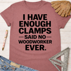 Women's funny woodworking graphic tee shirt for female woodworkers, makers, and DIY builders — Sawdust & Ponytails. Mauve short-sleeve t-shirt with "I HAVE ENOUGH CLAMPS — SAID NO — WOODWORKER EVER." in black text.