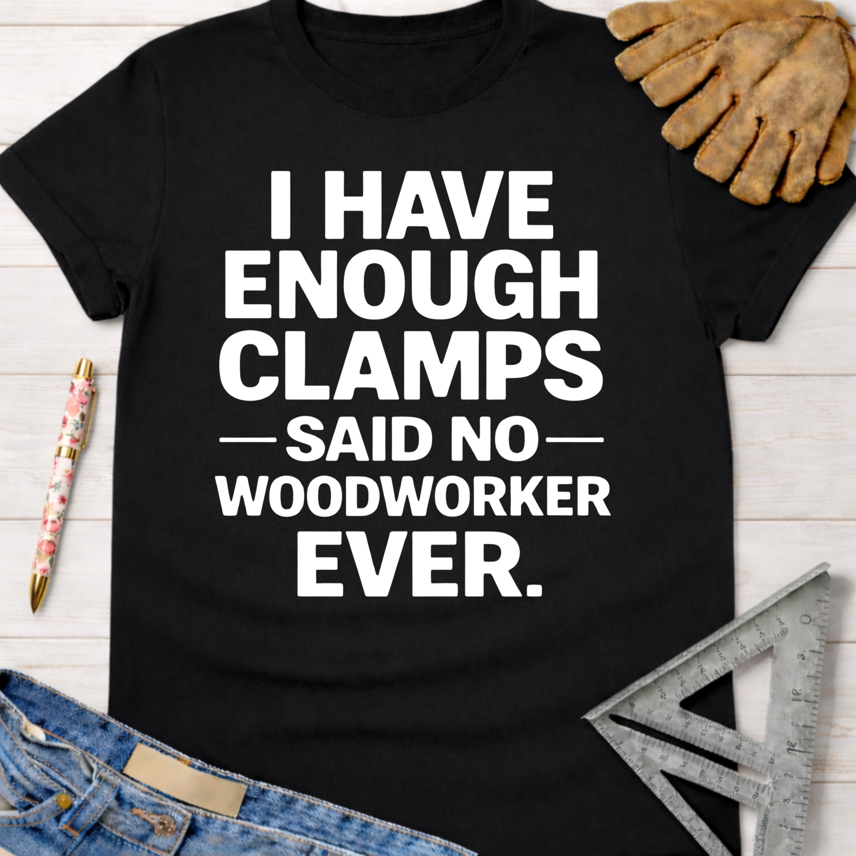 Black cotton t-shirt with "I Have Enough Clamps - Said No - Woodworker Ever" in white text. Women's funny woodworking graphic tee shirt for female woodworkers, makers, and DIY builders — Sawdust & Ponytails.