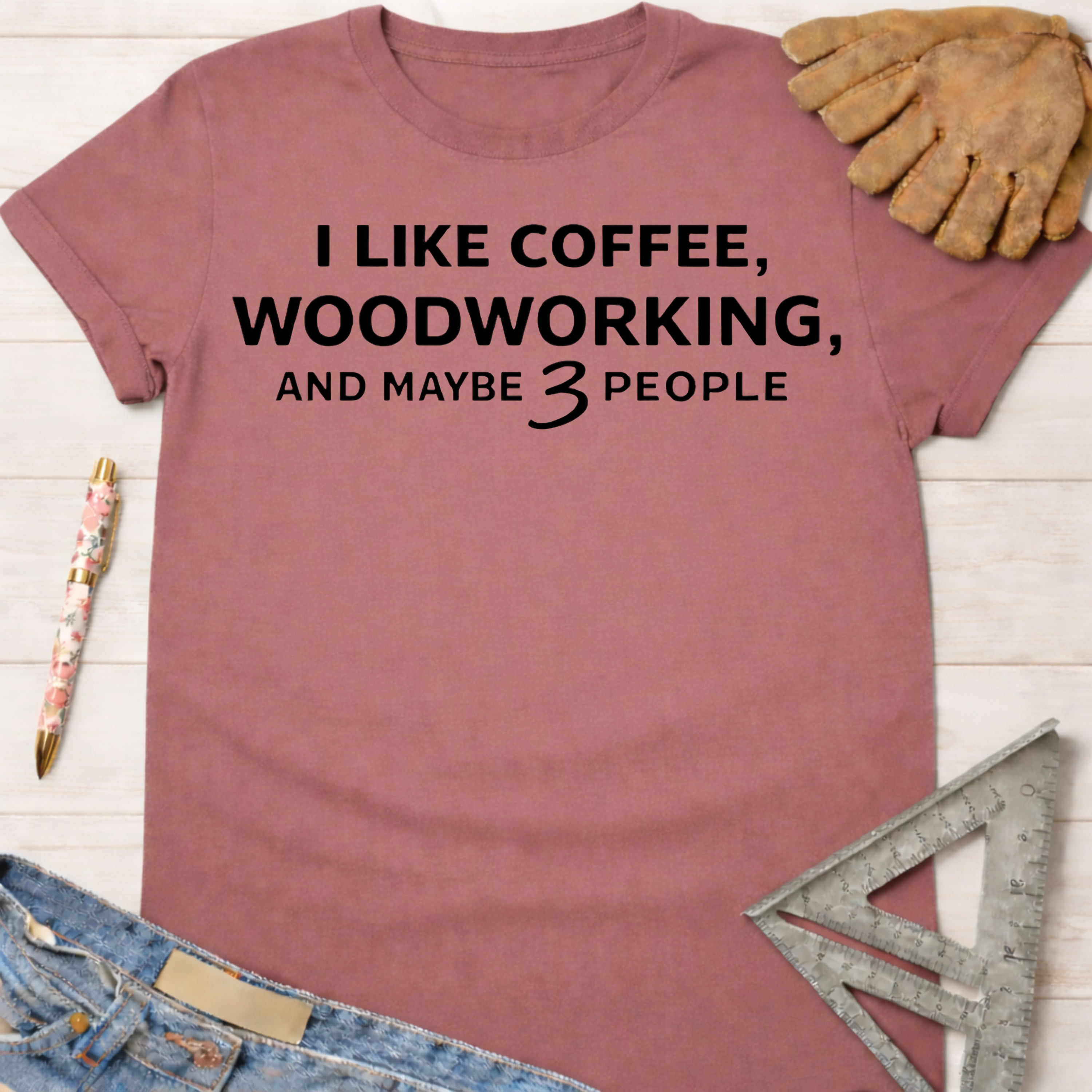 Women's funny woodworking graphic tee shirt for female woodworkers, makers, and DIY builders — Sawdust & Ponytails. Mauve t-shirt with "I LIKE COFFEE, WOODWORKING, AND MAYBE 3 PEOPLE" text.
