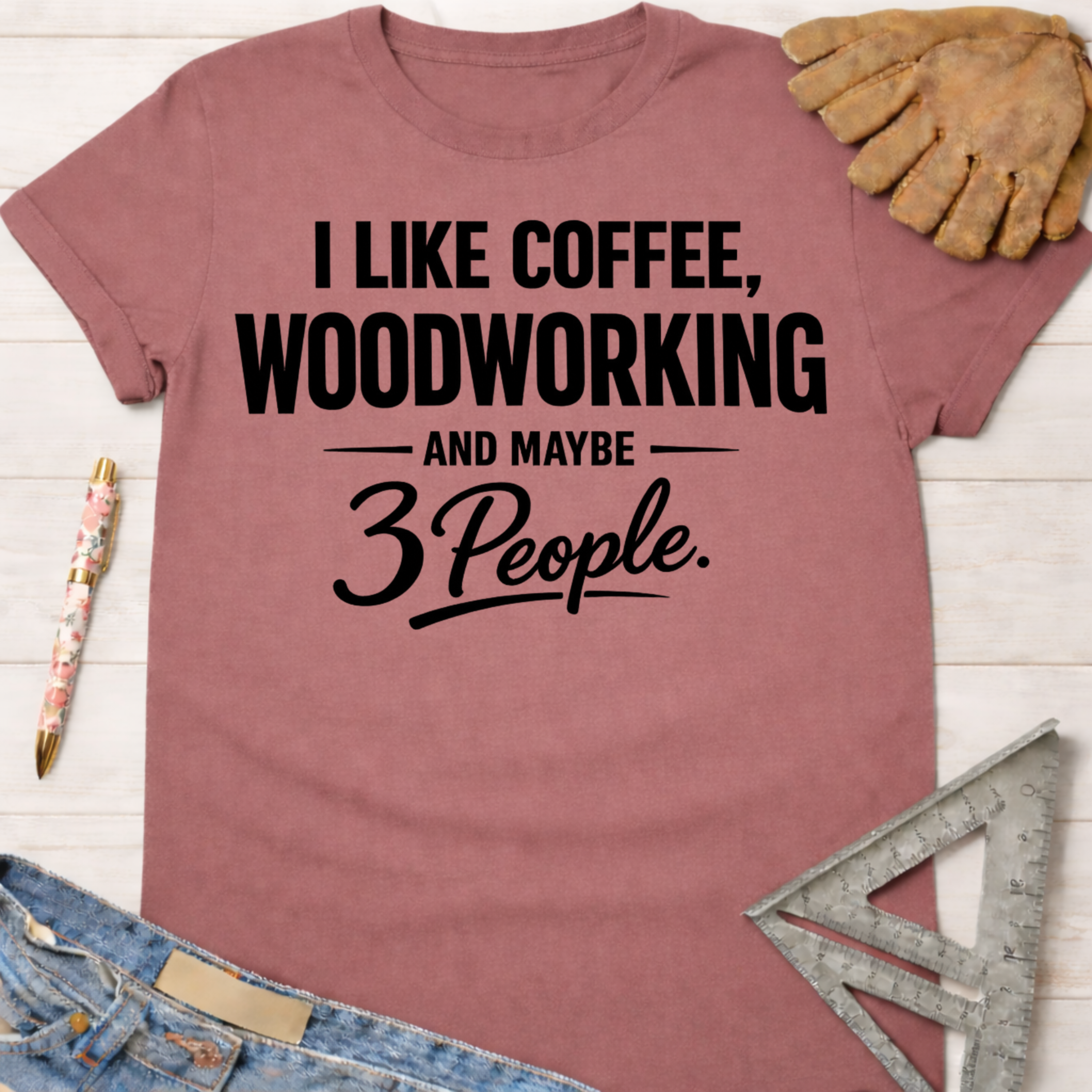 Women's funny woodworking graphic tee shirt for female woodworkers, makers, and DIY builders — Sawdust & Ponytails. Mauve t-shirt with "I Like Coffee, Woodworking & Maybe 3 People" text.