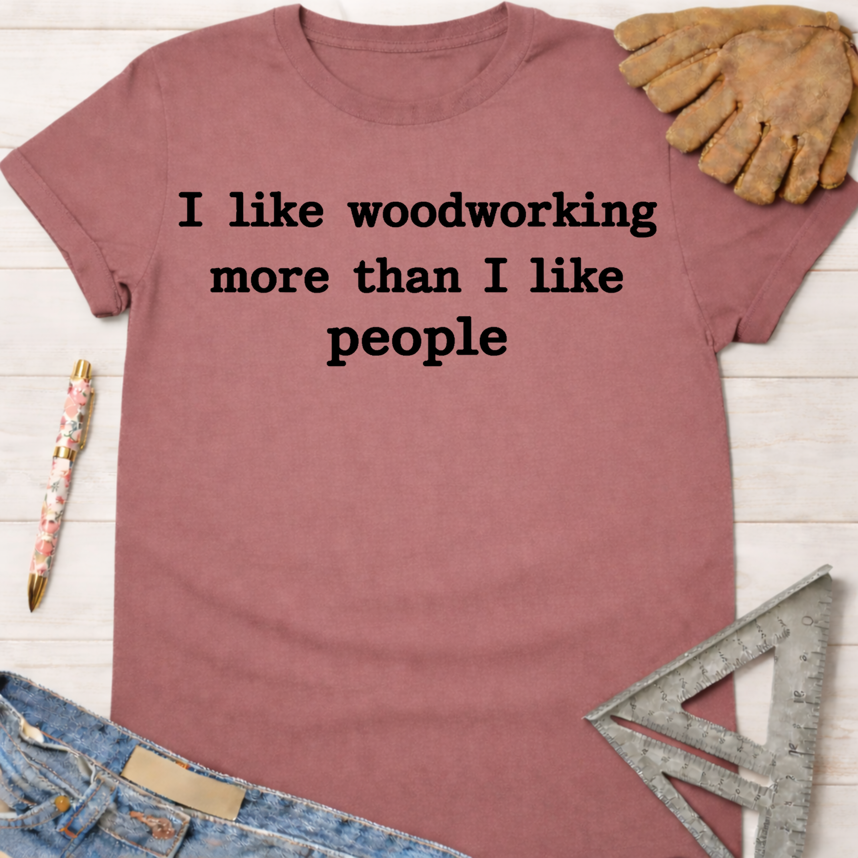 Women's funny woodworking graphic tee shirt for female woodworkers, makers, and DIY builders — Sawdust & Ponytails. Mauve cotton t-shirt with "I like woodworking more than I like people" text.
