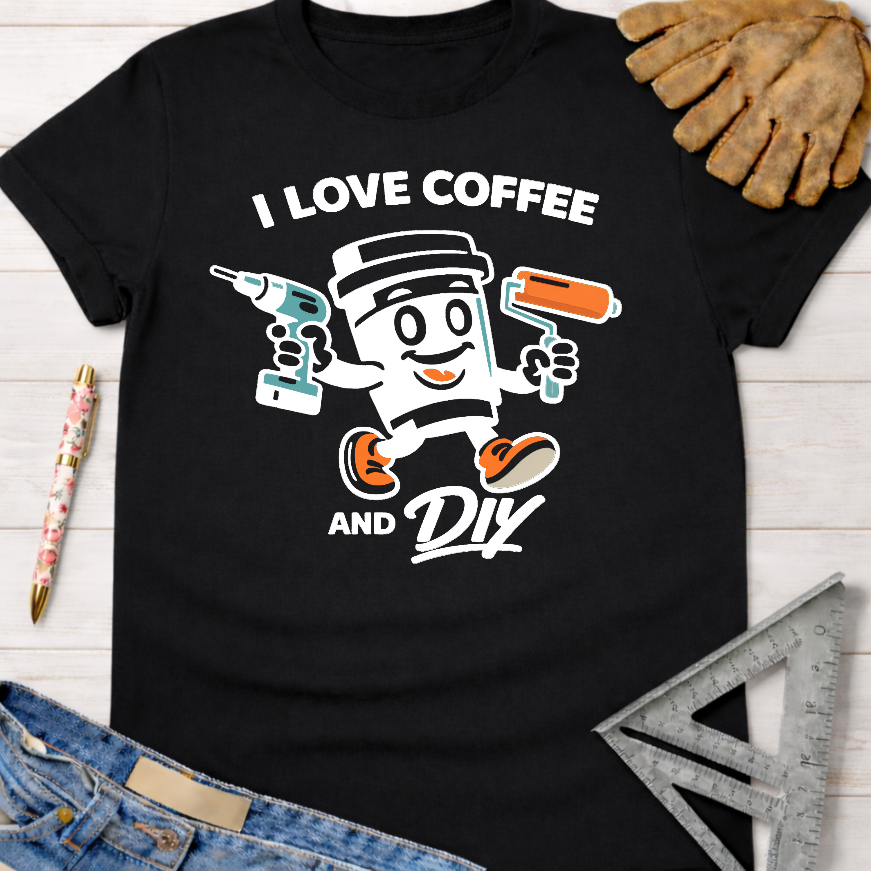 Women's funny woodworking graphic tee shirt for female woodworkers, makers, and DIY builders — Sawdust & Ponytails. Black cotton t-shirt with "I Love Coffee and DIY" text and a coffee cup mascot holding a drill and paint roller.