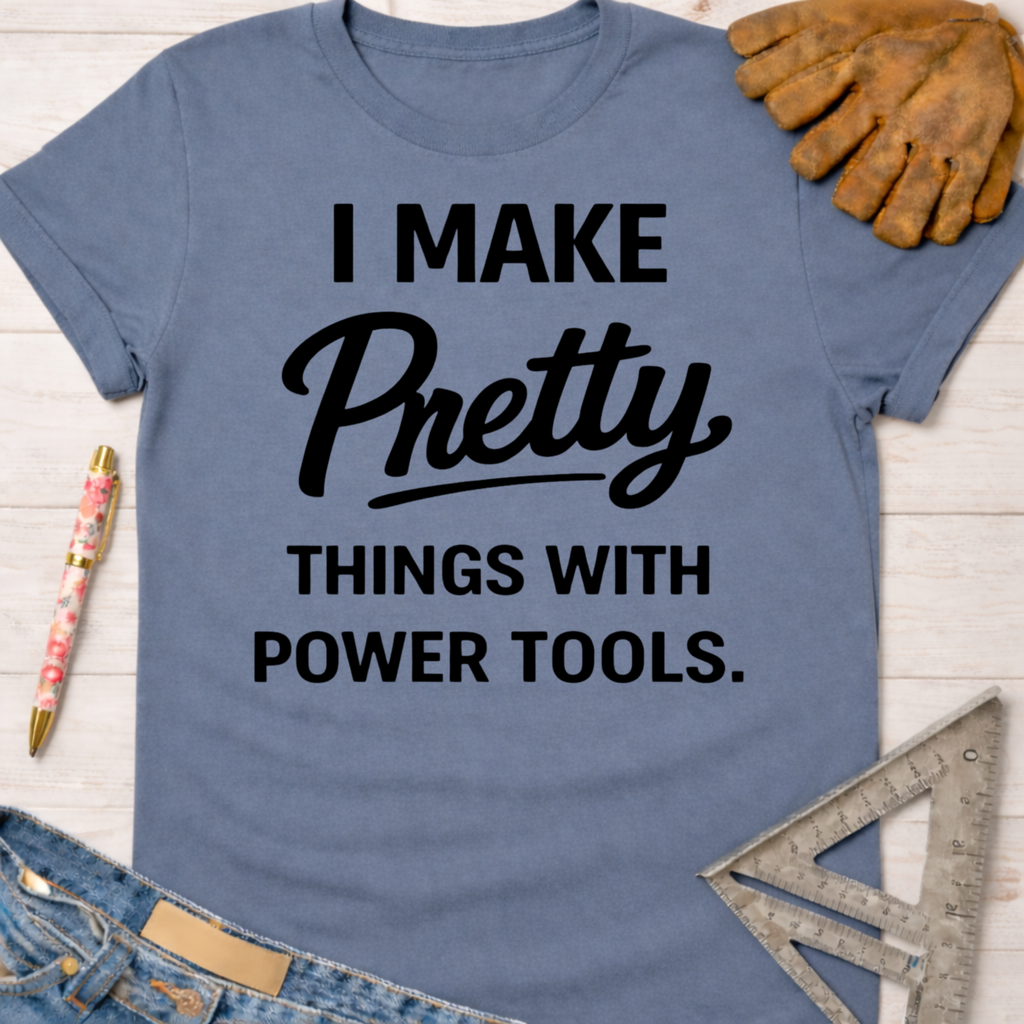 Women's funny woodworking graphic tee shirt for female woodworkers, makers, and DIY builders — Sawdust & Ponytails. Blue "I Make Pretty Things With Power Tools" t-shirt with work gloves and ruler.