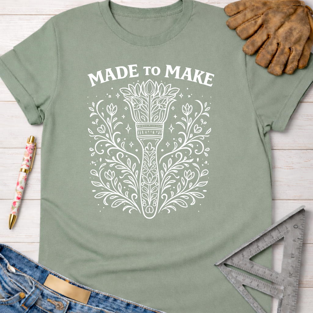 Sage green "Made To Make" tee with a floral-inspired paintbrush graphic. Women's funny woodworking graphic tee shirt for female woodworkers, makers, and DIY builders — Sawdust & Ponytails