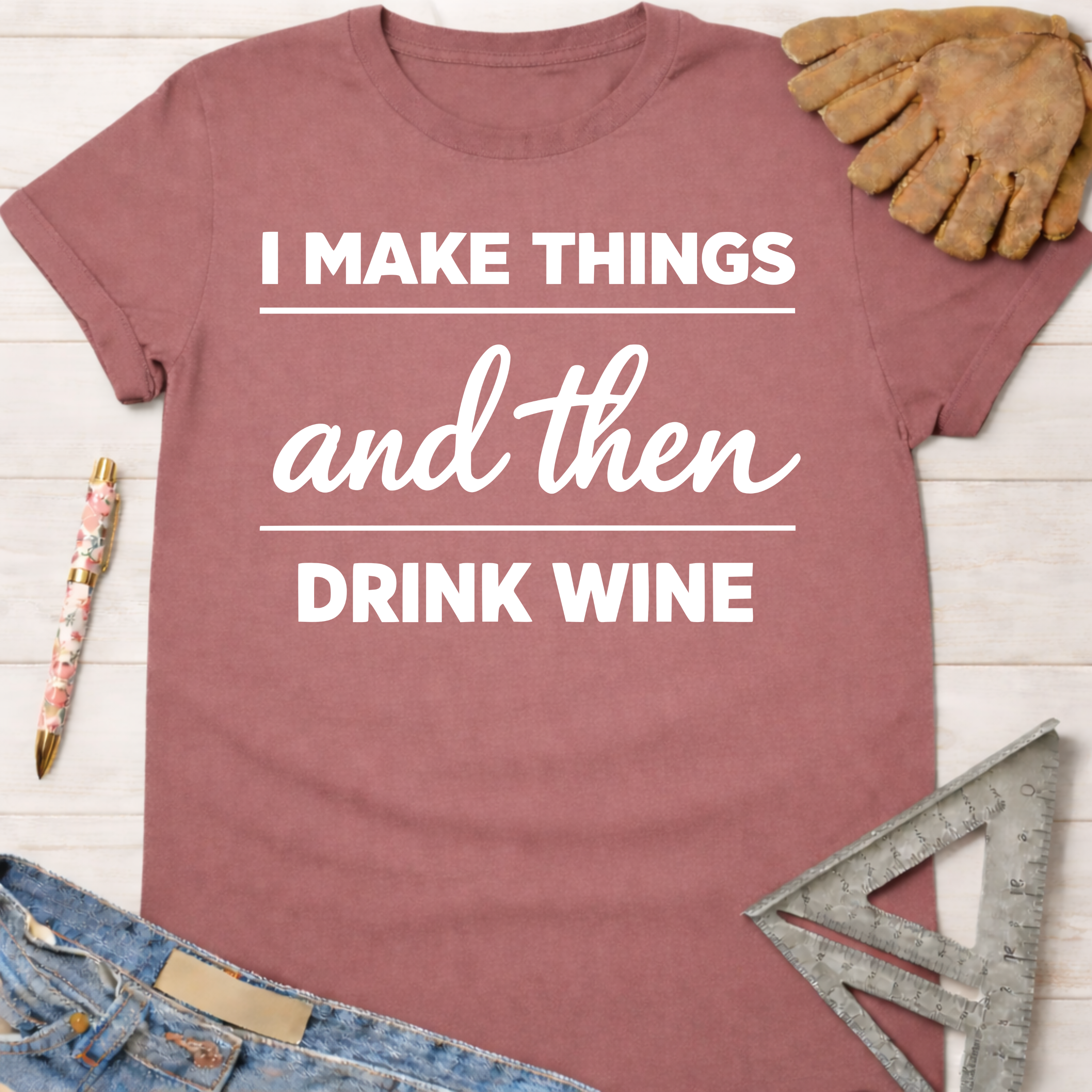 Women's funny woodworking graphic tee shirt for female woodworkers, makers, and DIY builders — Sawdust & Ponytails. Mauve cotton t-shirt with "I Make Things and Then Drink Wine" in white text.