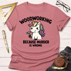 Women's funny woodworking graphic tee shirt for female woodworkers, makers, and DIY builders — Sawdust & Ponytails. Pink t-shirt with a unicorn holding a hammer and "Woodworking Because Murder Is Wrong" text.