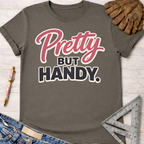 Charcoal gray "Pretty But Handy" graphic tee, women's funny woodworking shirt for female woodworkers, makers, and DIY builders — Sawdust & Ponytails
