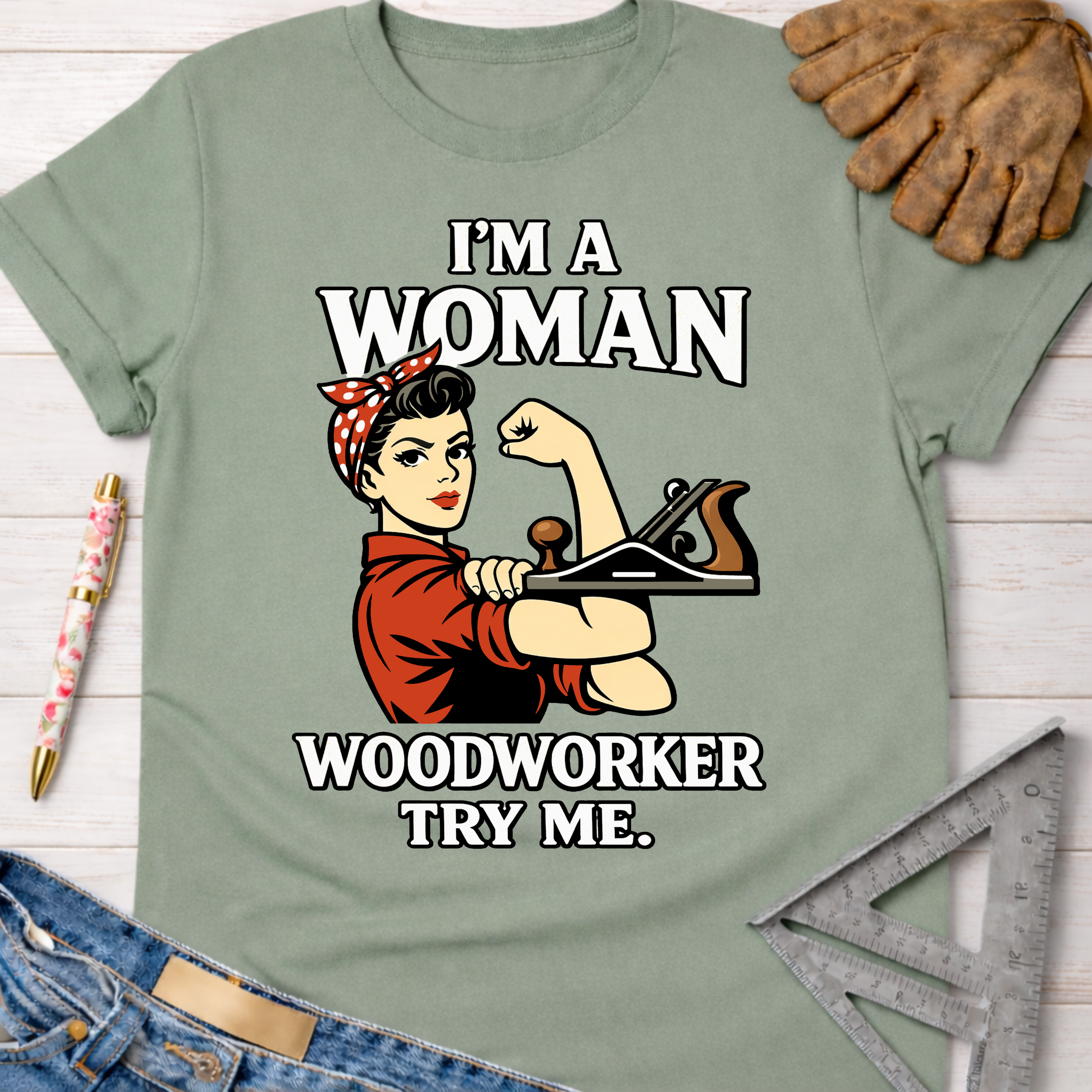 Sage green "I'm A Woman Woodworker Try Me" Rosie the Riveter graphic tee, Sawdust & Ponytails.