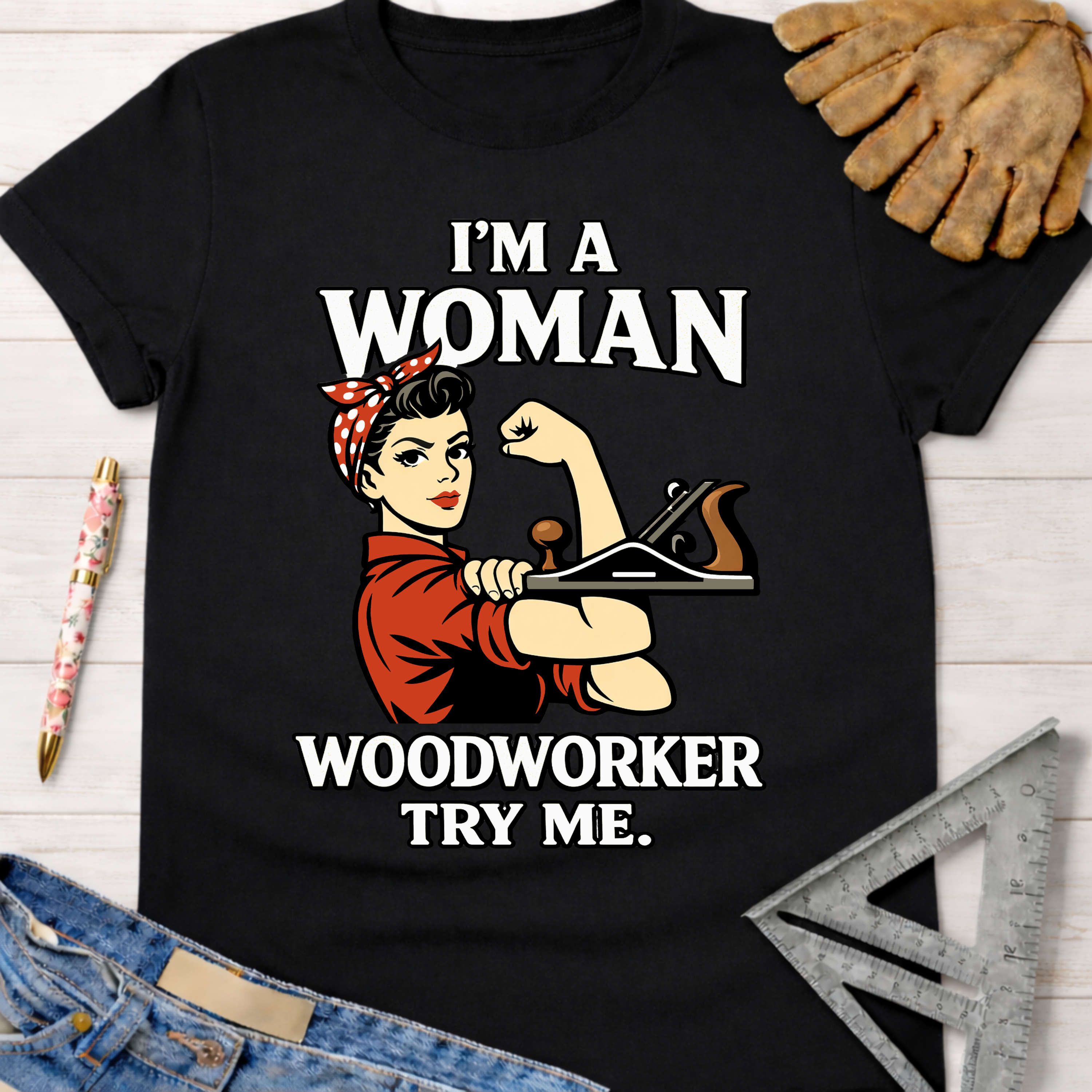 Black cotton "I'm A Woman Woodworker Try Me" graphic tee with Rosie the Riveter holding a plane. Women's funny woodworking graphic tee shirt for female woodworkers, makers, and DIY builders — Sawdust & Ponytails.