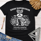 Black cotton women's funny woodworking graphic tee with a white dog "Shop Supervisor" design.