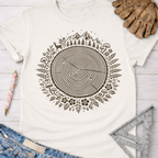 Women's funny woodworking graphic tee shirt for female woodworkers, makers, and DIY builders — Sawdust & Ponytails. Cream t-shirt with a brown tree ring of life graphic, mountains, deer, and mushrooms.