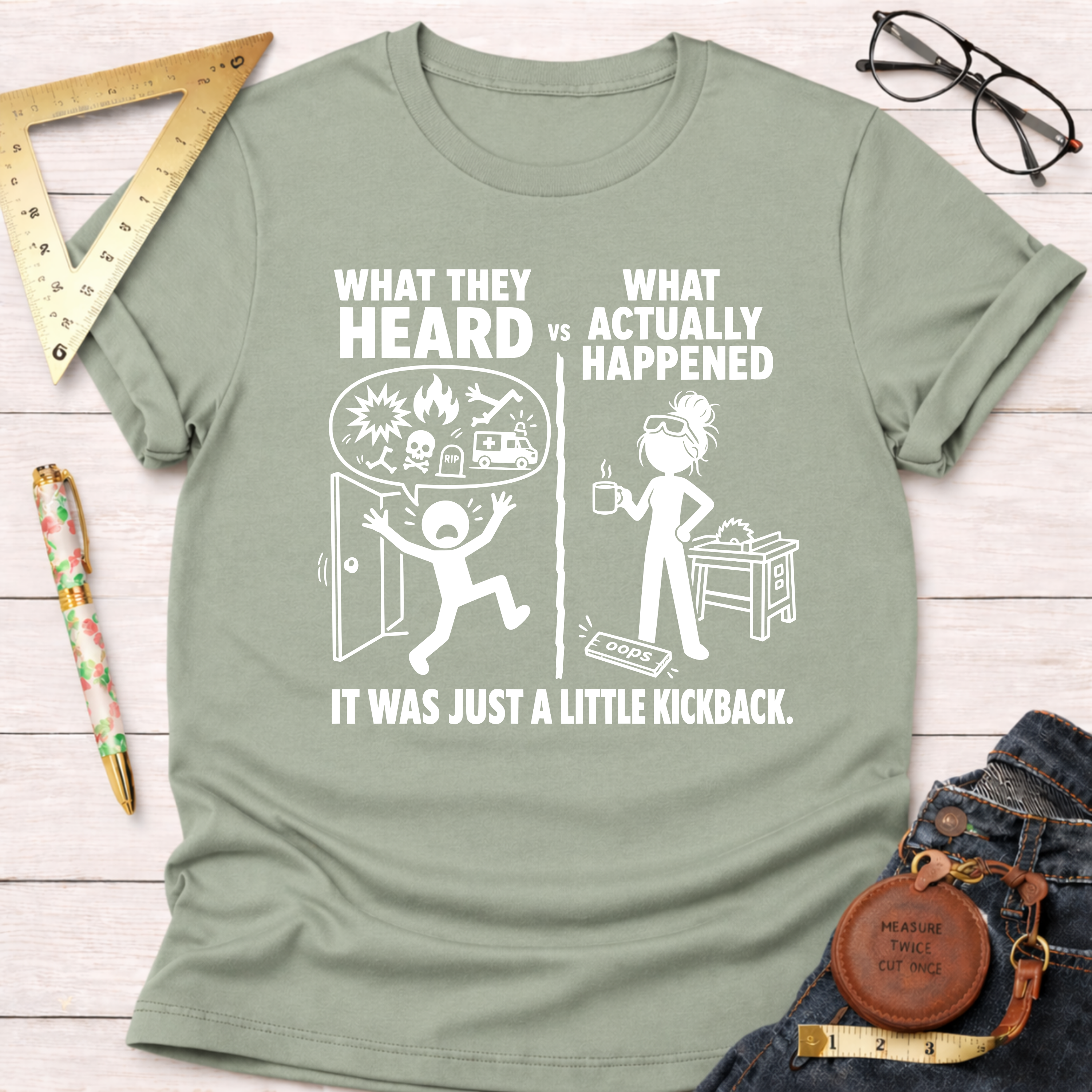 Women's funny woodworking graphic tee shirt for female woodworkers, makers, and DIY builders — Sawdust & Ponytails. Sage green cotton tee with "What They Heard VS What Actually Happened" design.