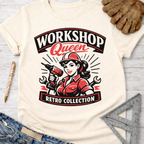 Cream "Workshop Queen Retro Collection" tee with a female woodworker graphic holding a drill. Women's funny woodworking graphic tee shirt for female woodworkers, makers, and DIY builders — Sawdust & Ponytails