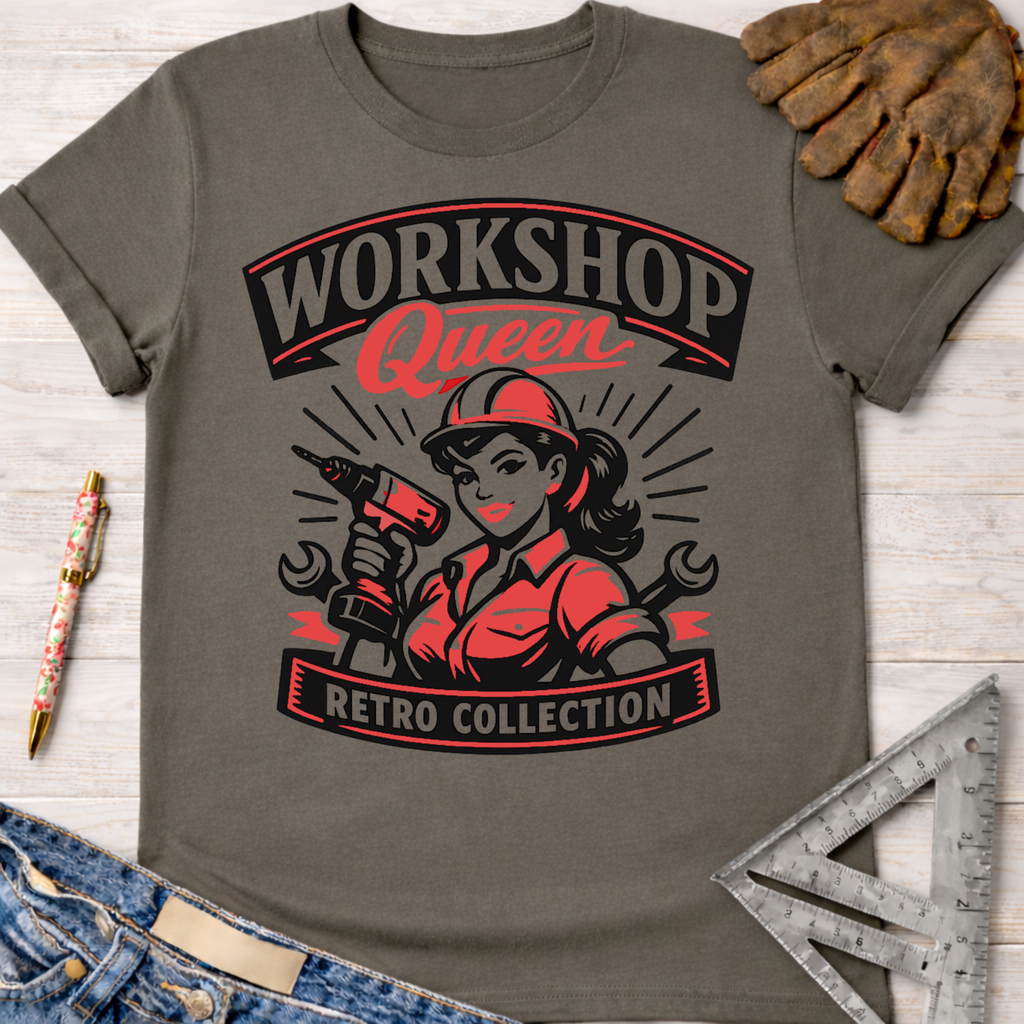 Women's funny woodworking graphic tee shirt for female woodworkers, makers, and DIY builders — Sawdust & Ponytails. Dark gray tee with "Workshop Queen Retro Collection" graphic featuring a woman with a drill.