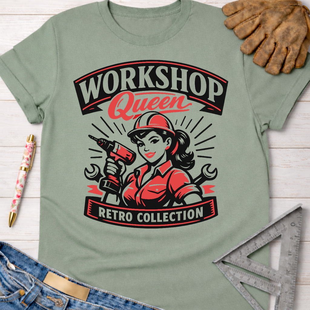 Women's funny woodworking graphic tee shirt for female woodworkers, makers, and DIY builders — Sawdust & Ponytails. Light green cotton tee with "Workshop Queen Retro Collection" graphic featuring a woman in a hard hat holding a drill.